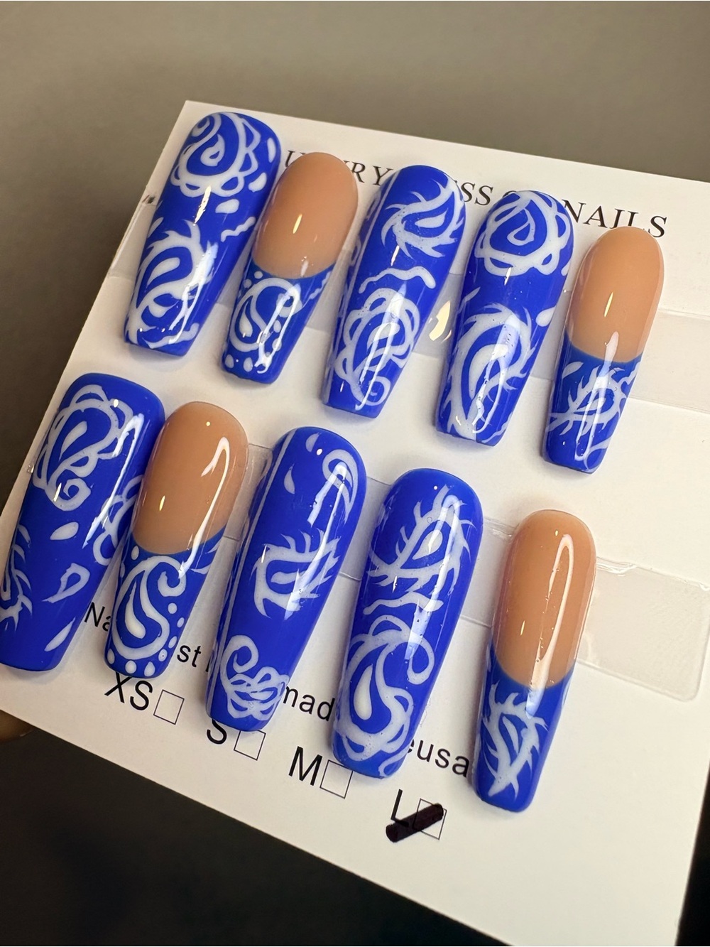 Bold Blue Swirl Press-On Nails with Nude Accents